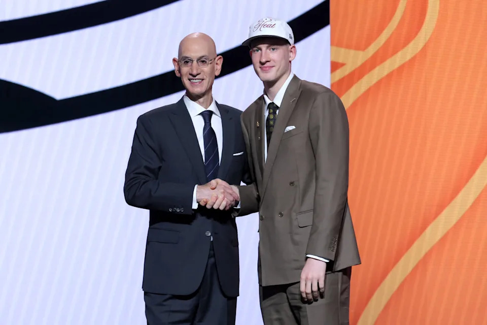 Kasparas Jakucionis stands with NBA commissioner Adam Silver after being selected as the 20th pick by the Miami Heat. Brad Penner-Imagn Images