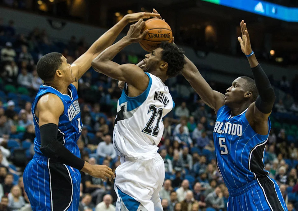 Minnesota Timberwolves guard Andrew Wiggins shoots the ball as Orlando Magic guard Victor Oladipo and forward Tobias Harris defend.Brace Hemmelgarn-USA TODAY Sports