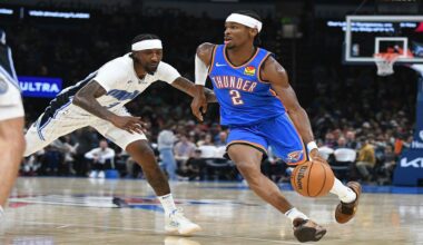 Oklahoma City Thunder guard Shai Gilgeous-Alexander (2) pushes past Orlando Magic guard Kentavious Caldwell-Pope (3) during the second half of an NBA basketball game, Monday, Nov. 4, 2024, in Oklahoma City. (AP Photo/Kyle Phillips)