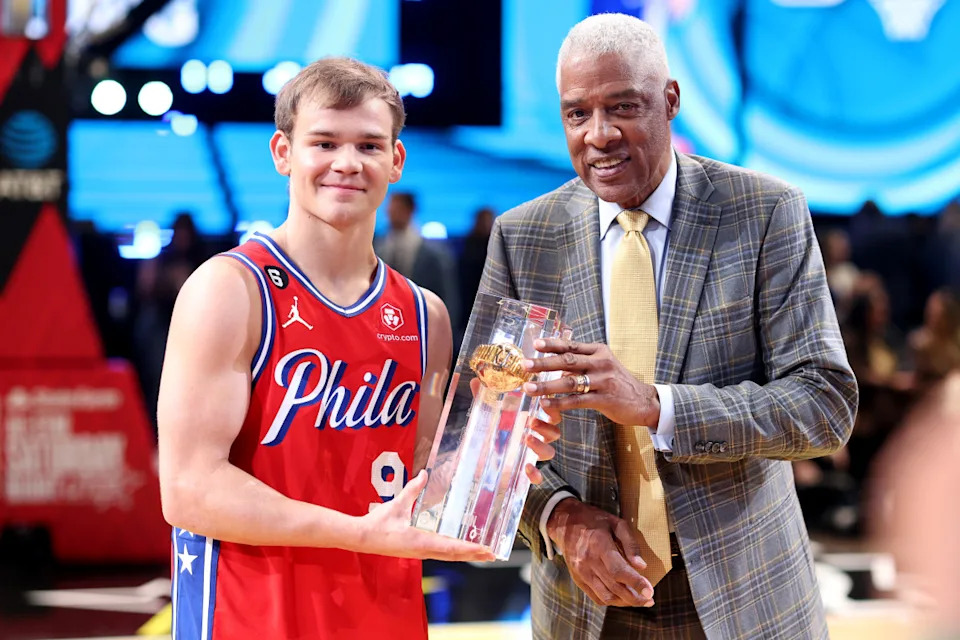 SALT LAKE CITY, UTAH - FEBRUARY 18: Mac McClung #9 of the Philadelphia 76ers and former professional basketball player Julius Erving and pose with the trophy after McClung's victory in the 2023 NBA All Star AT&T Slam Dunk Contest at Vivint Arena on February 18, 2023 in Salt Lake City, Utah. NOTE TO USER: User expressly acknowledges and agrees that, by downloading and or using this photograph, User is consenting to the terms and conditions of the Getty Images License Agreement. (Photo by Tim Nwachukwu/Getty Images)Tim Nwachukwu/Getty Images