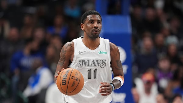 FILE - Dallas Mavericks guard Kyrie Irving advances the ball up court during an NBA basketball game against the Milwaukee Bucks in Dallas, Saturday, March 1, 2025. (AP Photo/Tony Gutierrez,File)