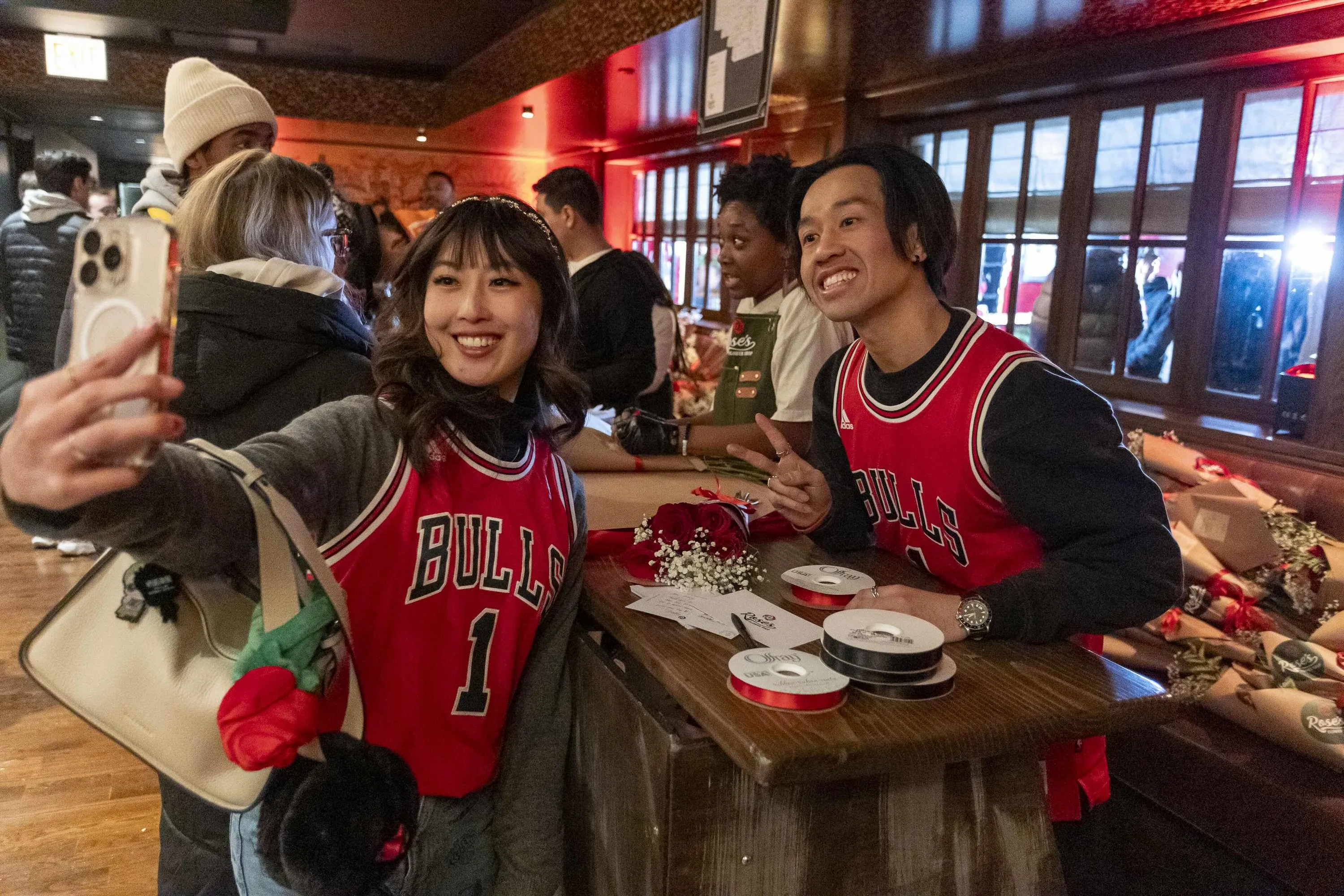 fans take a selfie at the bouquet station