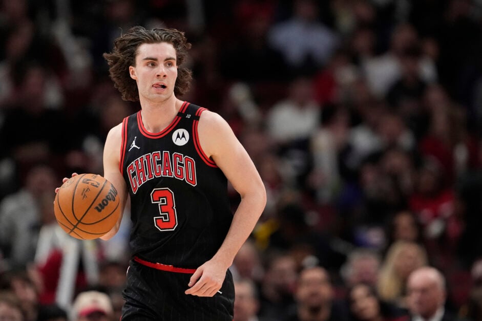 Josh Giddey #3 of the Chicago Bulls dribbles the ball against the Miami Heat during the third quarter at the United Center.