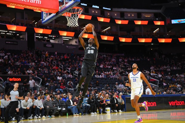 San Antonio Spurs' Omari Moore (29) goes up for a dunk against the Golden State Warriors in the first quarter of their California Classic Summer League game at Chase Center in San Francisco, Calif., on Sunday, July 6, 2025. (Jose Carlos Fajardo/Bay Area News Group)