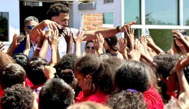 Washington Wizards forward Anthony Gill gives 200 backpacks to kids at Samuel W. Tucker Elementary School