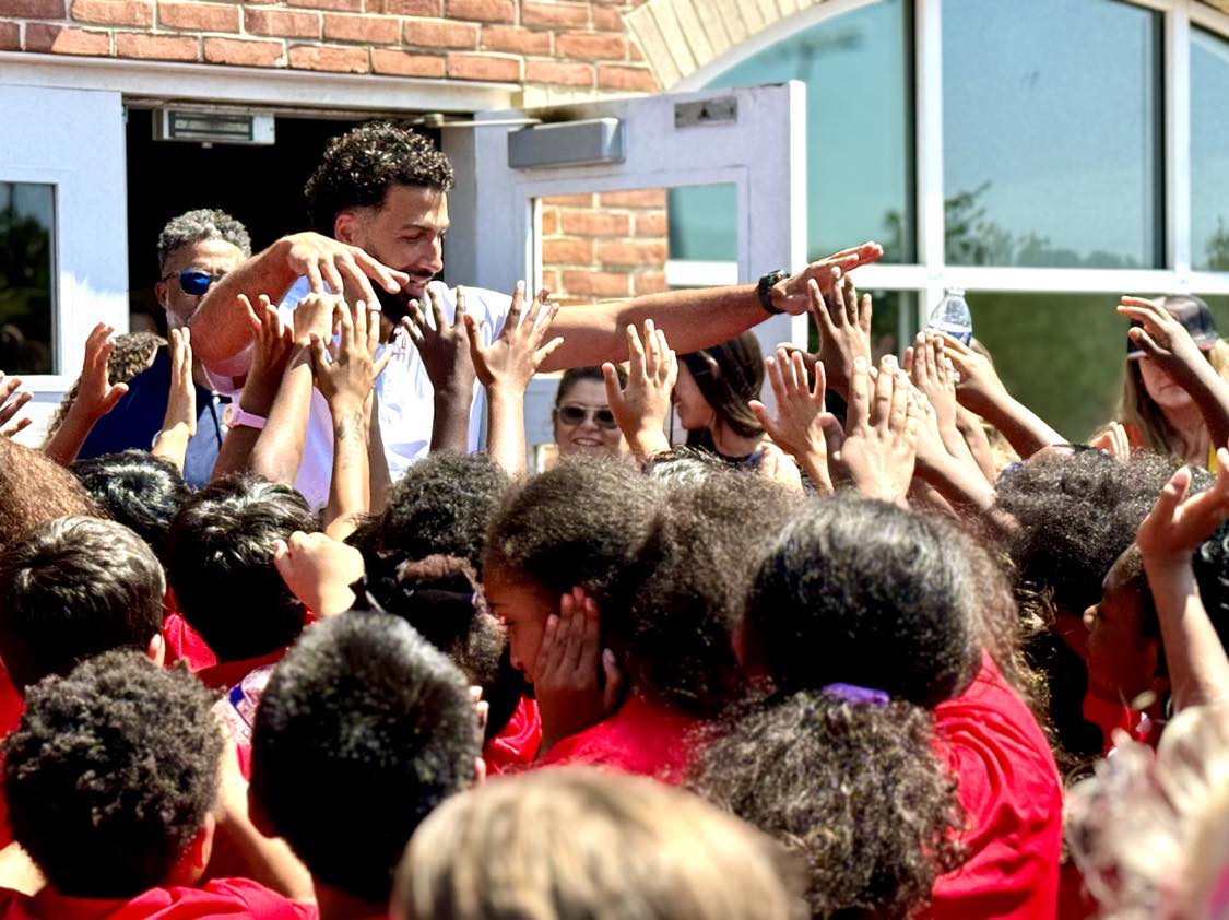 Washington Wizards forward Anthony Gill gives 200 backpacks to kids at Samuel W. Tucker Elementary School