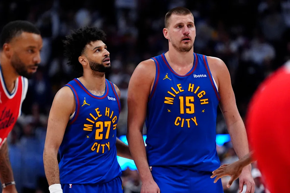 Denver Nuggets center Nikola Jokic (15) and Denver Nuggets guard Jamal Murray (27).Ron Chenoy-Imagn Images
