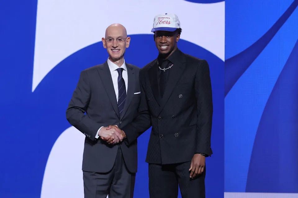 VJ Edgecombe stands with NBA commissioner Adam Silver after being selected as the third pick by the Philadelphia 76ers in the first round of the 2025 NBA Draft at Barclays Center.Brad Penner-Imagn Images