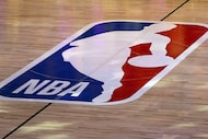FILE -  An NBA logo is seen at center court prior to an NBA basketball game between the Los...