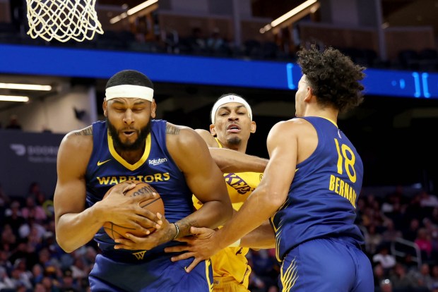Golden State Warriors' Marques Bolden (20) gains a rebound against the Los Angeles Lakers' Darius Bazley (36) in the second quarter of an NBA Summer League game at Chase Center in San Francisco, Calif., on Saturday, July 5, 2025. (Ray Chavez/Bay Area News Group)