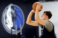 Dallas Mavericks rookie forward Cooper Flagg shoots three-pointers following their first...