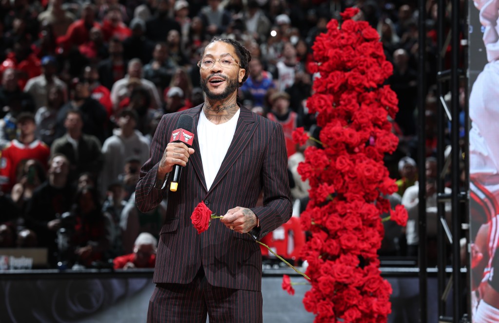 Derrick Rose talks to the crowd during halftime of the Knicks-Bulls game. 