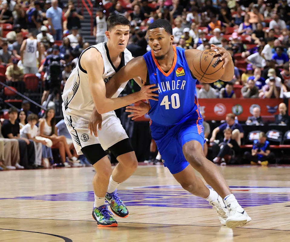 LAS VEGAS, NEVADA - JULY 10: Chris Youngblood #40 of the Oklahoma City Thunder drives against Egor Demin #8 of the Brooklyn Nets in the first half of a 2025 NBA Summer League game at the Thomas & Mack Center on July 10, 2025 in Las Vegas, Nevada.