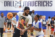 Dallas Mavericks forward Naji Marshall takes part in drills with the kids during Mavs youth...