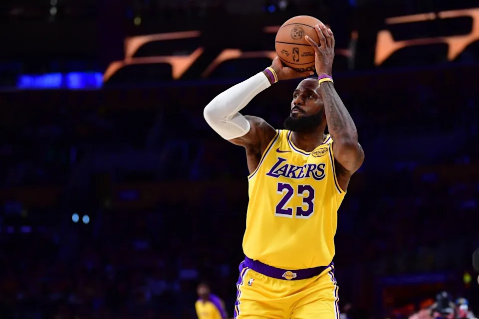 Dec 31, 2024; Los Angeles, California, USA; Los Angeles Lakers forward LeBron James (23) shoots a three point basket against the against the Cleveland Cavaliers during the first half at Crypto.com Arena. Mandatory Credit: Gary A. Vasquez-Imagn ImagesMandatory Credit: Gary A. Vasquez-Imagn Images