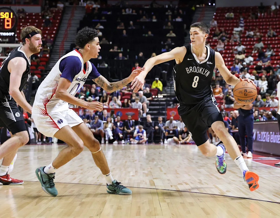 LAS VEGAS, NEVADA - JULY 13: Egor Demin #8 of the Brooklyn Nets drives against Will Riley #27 of the Washington Wizards in the first half of a 2025 NBA Summer League game at the Thomas & Mack Center on July 13, 2025 in Las Vegas, Nevada. NOTE TO USER: User expressly acknowledges and agrees that, by downloading and or using this photograph, User is consenting to the terms and conditions of the Getty Images License Agreement. (Photo by Ethan Miller/Getty Images)