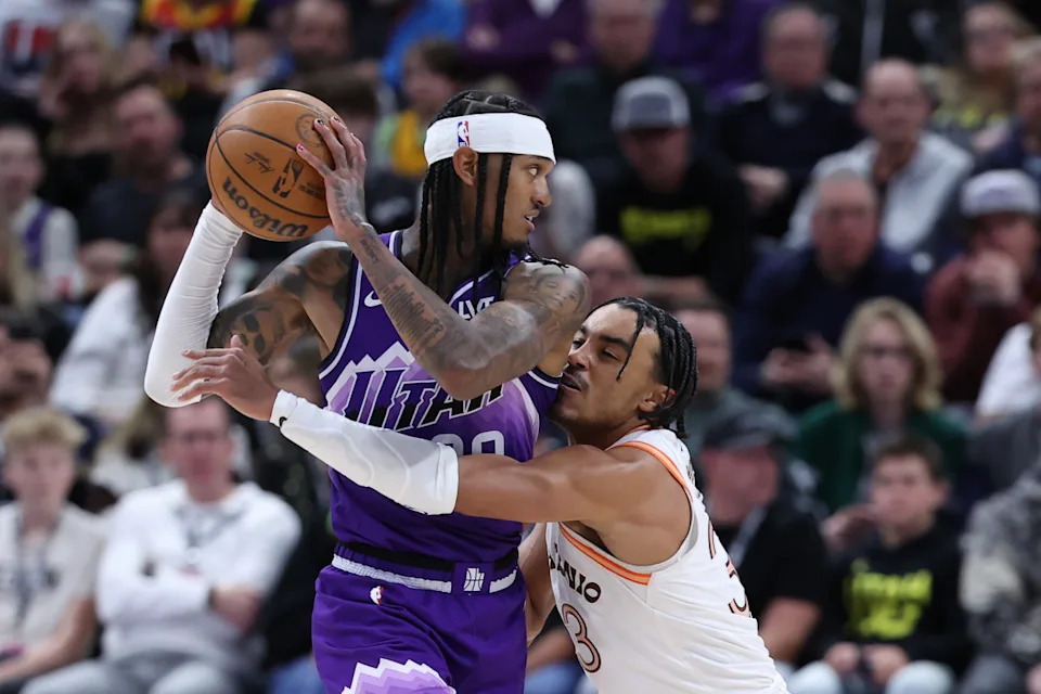 Feb 25, 2024; Salt Lake City, Utah, USA; Utah Jazz guard Jordan Clarkson (00) holds the ball away from San Antonio Spurs guard Tre Jones (33) during the fourth quarter at Delta Center. © Rob Gray-USA TODAY Sports