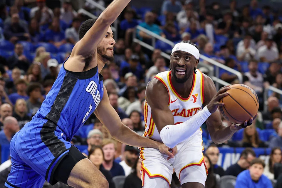 Orlando Magic guard Caleb Houstan guards Atlanta Hawks guard Caris LeVert in the first quarter at Kia Center, April 15, 2025 in Orlando.