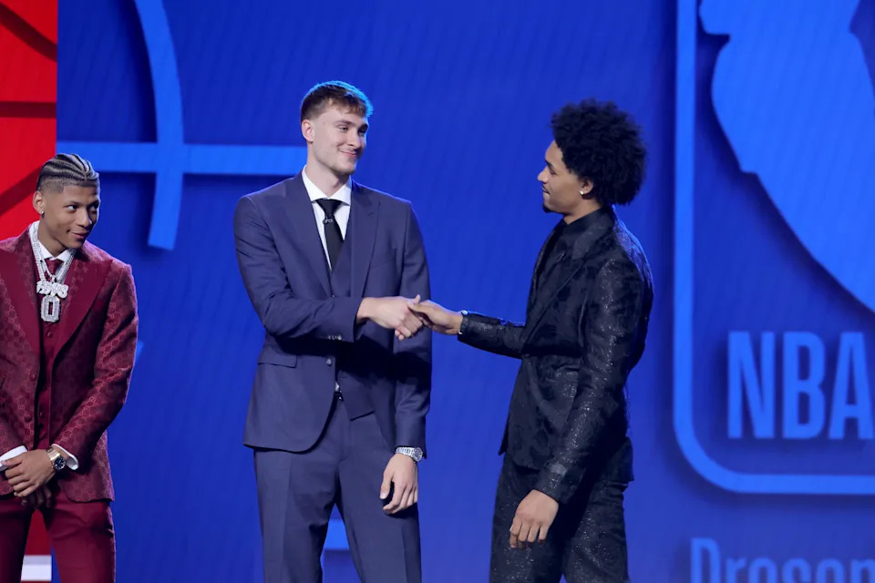 Jun 25, 2025; Brooklyn, NY, USA; Cooper Flagg and Dylan Harper shake hands on stage before the 2025 NBA Draft at Barclays Center. Mandatory Credit: Brad Penner-Imagn Images