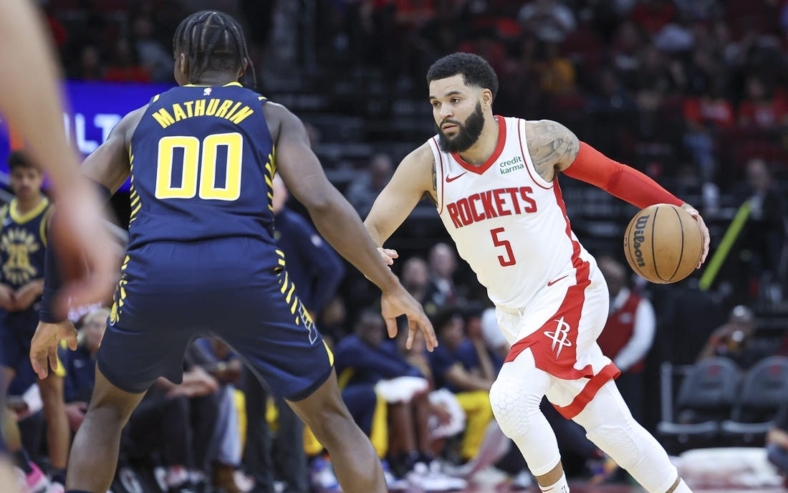 Oct 10, 2023; Houston, Texas, USA; Houston Rockets guard Fred VanVleet (5) dribbles the ball as Indiana Pacers guard Bennedict Mathurin (00) defends during the second quarter at Toyota Center. Mandatory Credit: Troy Taormina-USA TODAY Sports