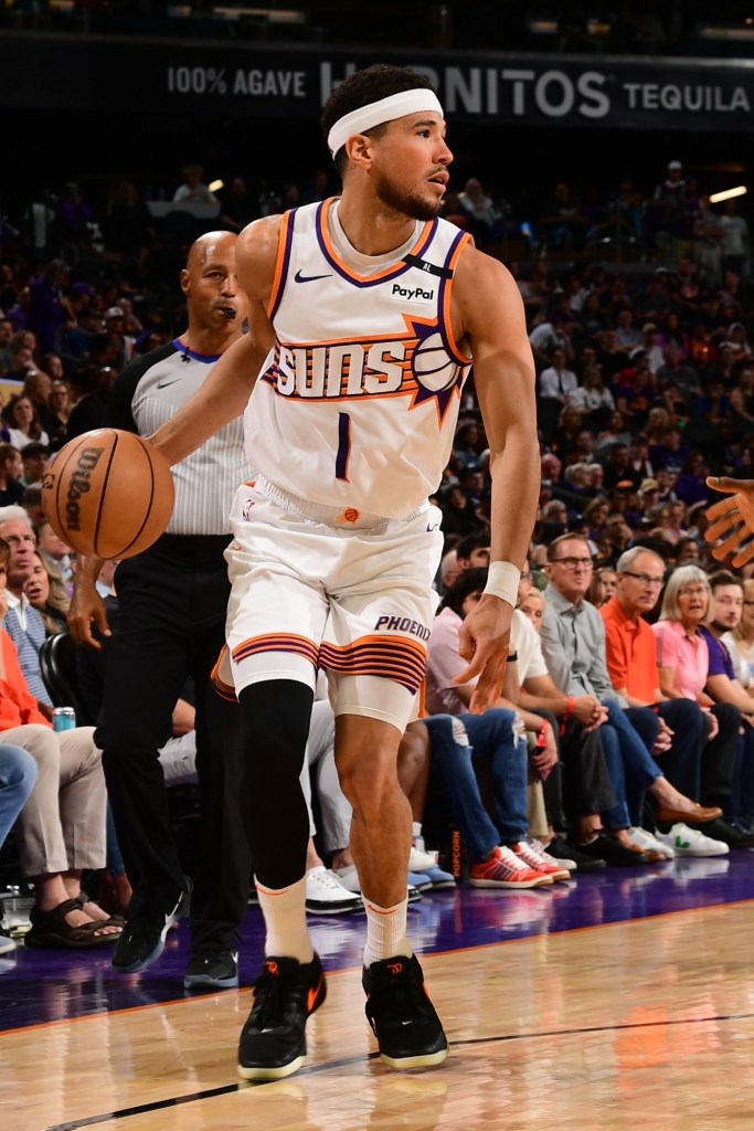 Devin Booker #1 of the Phoenix Suns dribbles the ball during the game against the San Antonio Spurs on April 11, 2025 at Footprint Center in Phoenix, Arizona.