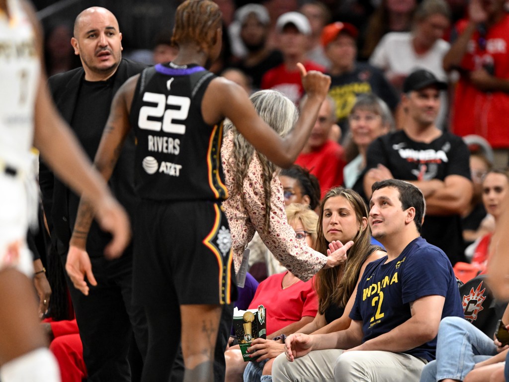 Saniya Rivers #22 of the Connecticut Sun gets into an altercation with an Indiana Fever fan during the first half at the TD Garden on July 15, 2025 in Boston, Massachusetts. 