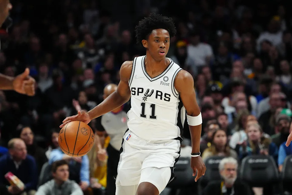 Apr 5, 2022; Denver, Colorado, USA; San Antonio Spurs guard Joshua Primo (11) handles the ball during the second half against the Denver Nuggets at Ball Arena. Mandatory Credit: Ron Chenoy-USA TODAY Sports