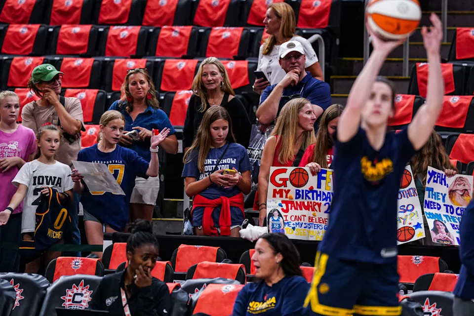 Jul 15, 2025; Boston, Massachusetts, USA; Indiana Fever fans look on as guard Caitlin Clark (22) warms up before the start of the game against the Connecticut Sun at TD Garden. Mandatory Credit: David Butler II-Imagn Images