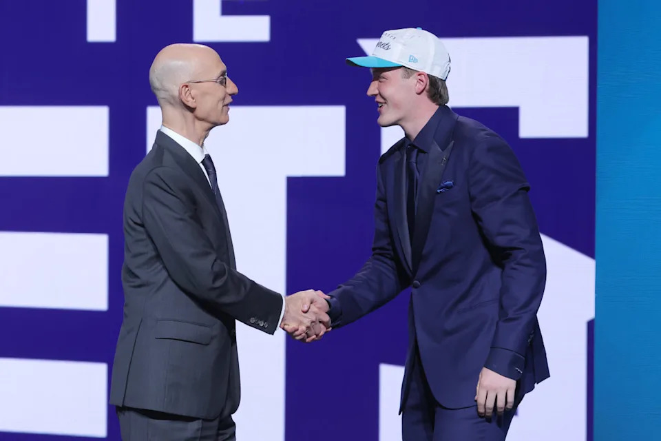 Kon Knueppel shakes hands with NBA commissioner Adam Silver after being selected as the fourth pick by the Charlotte Hornets in the first round of the 2025 NBA Draft.Brad Penner-Imagn Images