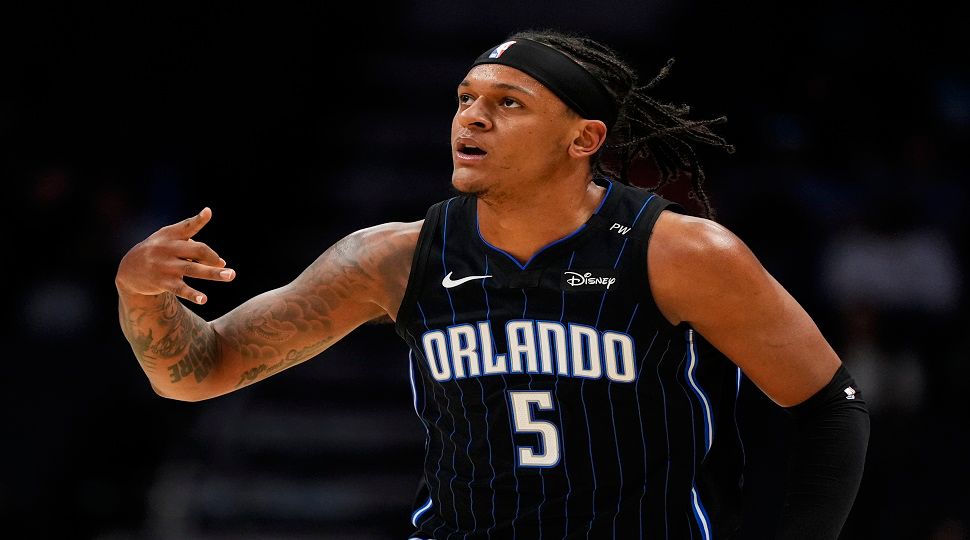 Orlando Magic forward Paolo Banchero celebrates after scoring against the Charlotte Hornets during the first half of an NBA basketball game on, Tuesday, March 25, 2025, in Charlotte, N.C. (AP Photo/Chris Carlson)