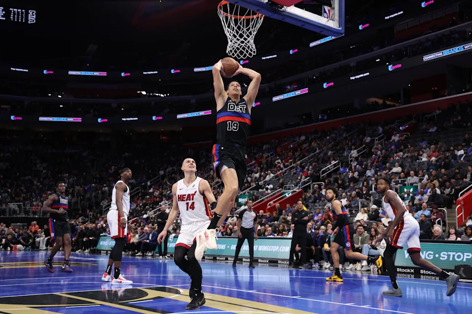 Simone Fontecchio of the Detroit Pistons dunks in the Nike Freak 6 NRG EP ‘Roses’ in front of Tyler Herro of the Miami Heat in the Nike Sabrina 2 ‘By You' during the second half in the first round of the Emirates NBA Cup at Little Caesars ArenaGregory Shamus&sol;Getty Images