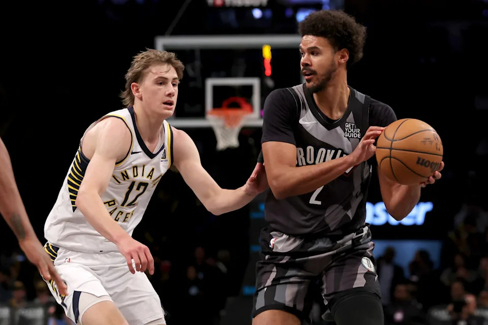 Dec 4, 2024; Brooklyn, New York, USA; Brooklyn Nets forward Cameron Johnson (2) looks to pass the ball against Indiana Pacers forward Johnny Furphy (12) during the third quarter at Barclays Center.© Brad Penner-Imagn Images