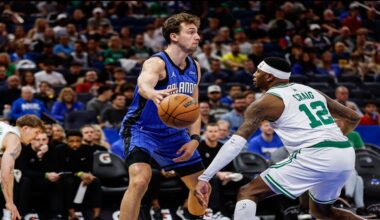 Orlando Magic forward Franz Wagner, left, passes the ball around Boston Celtics forward Torrey Craig (12) during the first half of an NBA basketball game, Wednesday, April 9, 2025, in Orlando, Fla. (AP Photo/Kevin Kolczynski)
