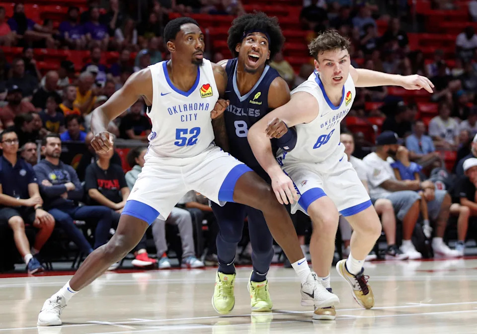SALT LAKE CITY, UT - JULY 5: Nate Hinton #8 of the Memphis Grizzlies tries to push through Zack Austin #52 and Alex Ducas #88 of the Oklahoma City Thunder during the first half of their NBA Summer League game at the Jon M. Huntsman Center on July 5, 2025 in Salt Lake City, Utah. NOTE TO USER: User expressly acknowledges and agrees that, by downloading and or using this photograph, User is consenting to the terms and conditions of the Getty Images License Agreement. (Photo by Chris Gardner/Getty Images)