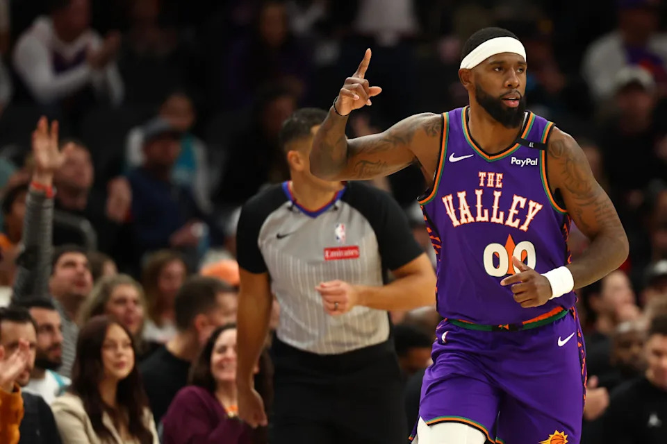 Jan 12, 2025; Phoenix, Arizona, USA; Phoenix Suns forward Royce O'Neale (00) reacts after a basket against the Charlotte Hornets during the second half at Footprint Center. Mandatory Credit: Mark J. Rebilas-Imagn Images Mandatory Credit: Mark J. Rebilas-Imagn Images