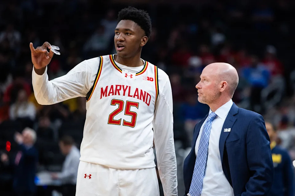 Maryland Terrapins head coach Kevin Willard talks with center Derik Queen (25).Trevor Ruszkowski-Imagn