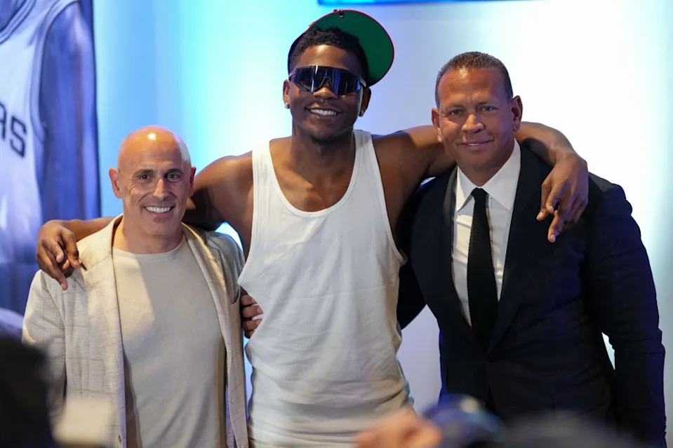 Timberwolves owners Marc Lore (L) and Alex Rodriguez pose with Minnesota star Anthony Edwards at a press conference at NBA Summer League on July 10, 2025 at the Thomas & Mack Center in Las Vegas, Nevada. NBAE via Getty Images