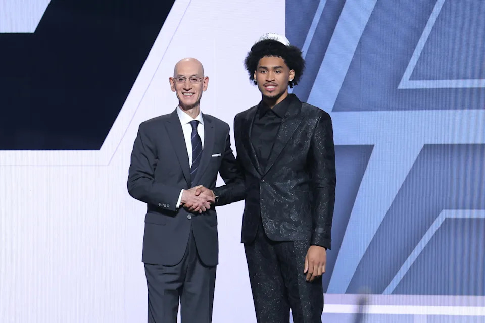 Jun 25, 2025; Brooklyn, NY, USA; Dylan Harper stands with NBA commissioner Adam Silver after being selected as the second pick by the San Antonio Spurs in the first round of the 2025 NBA Draft at Barclays Center. © Brad Penner-Imagn Images