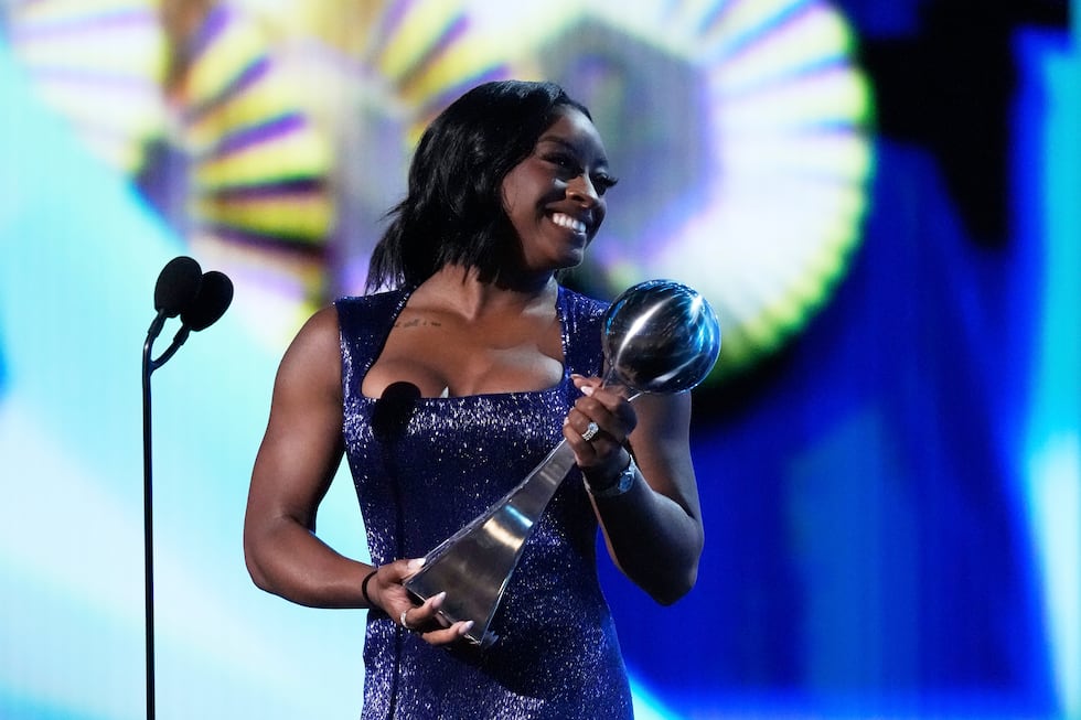 Simone Biles reacts after winning the Best Athlete in Women's Sports award at the ESPY Awards...