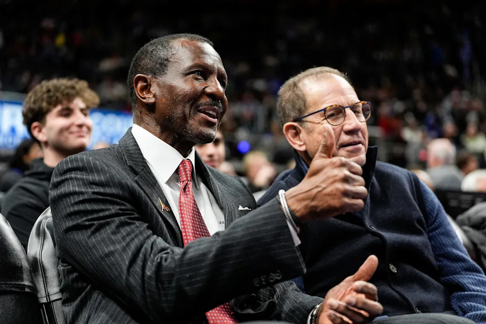 Former Pistons head coach Dwane Casey and vice chairman Arn Tellem watch the game between Detroit Pistons and Utah Jazz at Little Caesars Arena in Detroit on Thursday, Dec. 19, 2024.