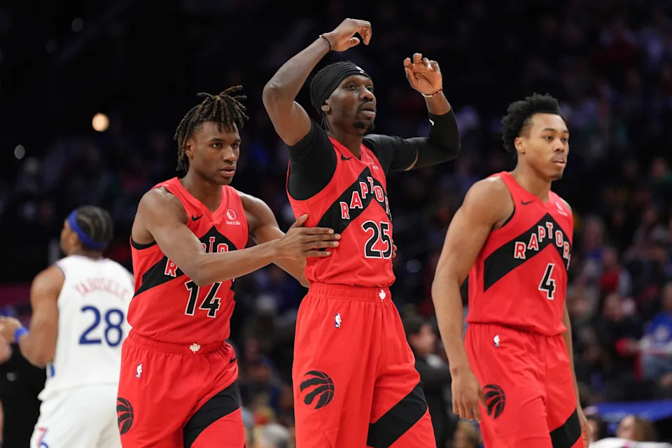 Toronto Raptors forward Chris Boucher reacts with guard Ja'Kobe Walter against the Philadelphia 76ers.Kyle Ross-Imagn Images