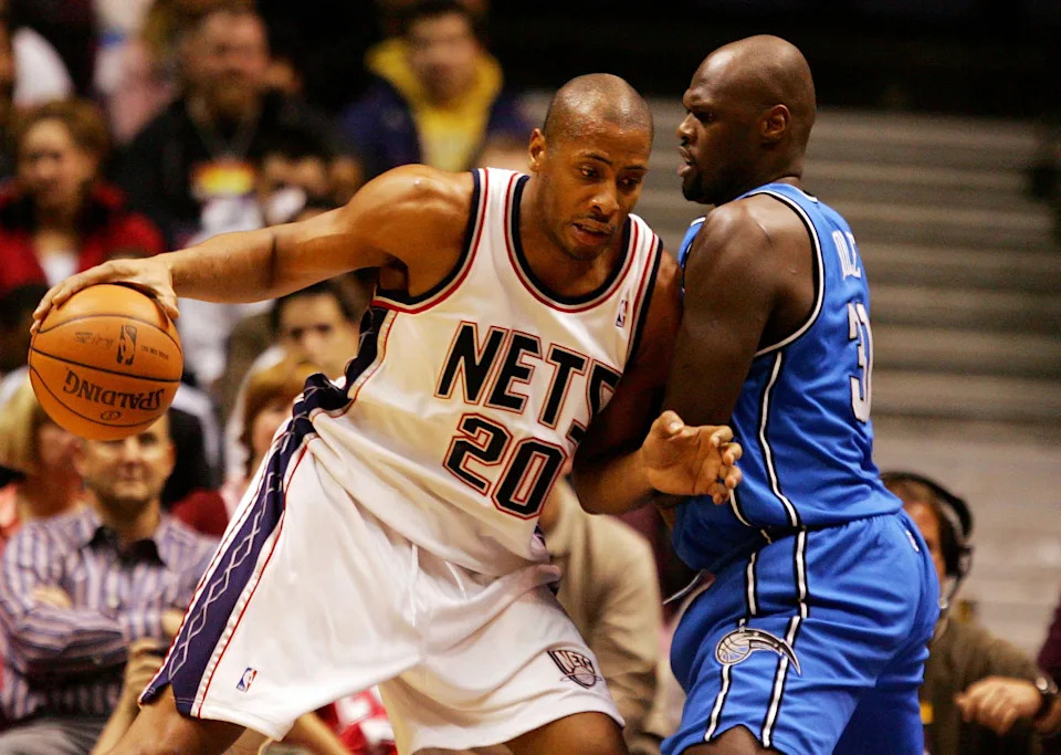EAST RUTHERFORD, NJ - NOVEMBER 16: Jameel Magloire #20 of the New Jersey Nets tries to drive past Adonel Foyle #31 of the Orlando Magic during their game at the Izod Center on November 16, 2007 in East Rutherford, New Jersey. NOTE TO USER: User expressly acknowledges and agrees that, by downloading and/or using this Photograph, User is consenting to the terms and conditions of the Getty Images License Agreement. (Photo by Jim McIsaac/Getty Images)