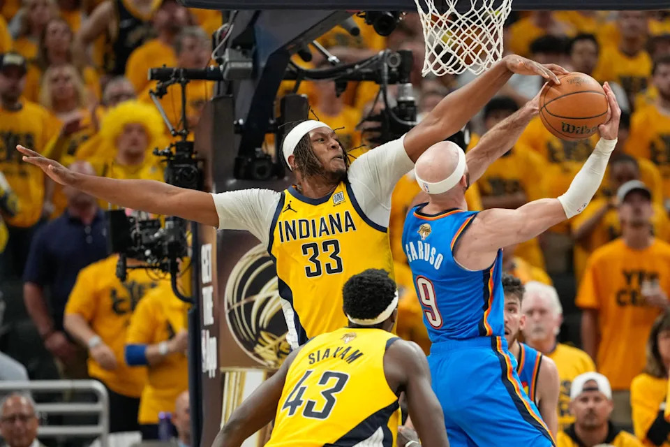 Indiana Pacers center Myles Turner (33) blocks a shot by Oklahoma City Thunder guard Alex Caruso (9) in the third quarter during game six of the 2025 NBA Finals at Gainbridge Fieldhouse. Kyle Terada-Imagn Images