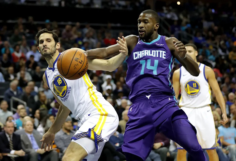 CHARLOTTE, NC - DECEMBER 06: Omri Casspi #18 of the Golden State Warriors goes after a loose ball against Michael Kidd-Gilchrist #14 of the Charlotte Hornets during their game at Spectrum Center on December 6, 2017 in Charlotte, North Carolina. NOTE TO USER: User expressly acknowledges and agrees that, by downloading and or using this photograph, User is consenting to the terms and conditions of the Getty Images License Agreement. (Photo by Streeter Lecka/Getty Images)