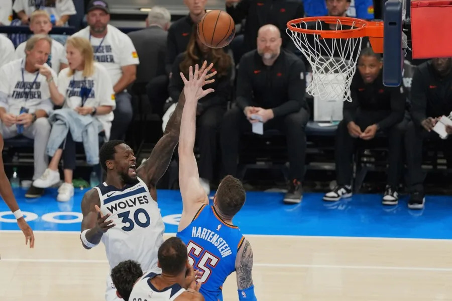 Minnesota Timberwolves forward Julius Randle (30) shoots over Oklahoma City Thunder center Isaiah Hartenstein (55) during the second half of Game 5 of the Western Conference finals of the NBA basketball playoffs, Wednesday, May 28, 2025, in Oklahoma City. (AP Photo/Kyle Phillips)