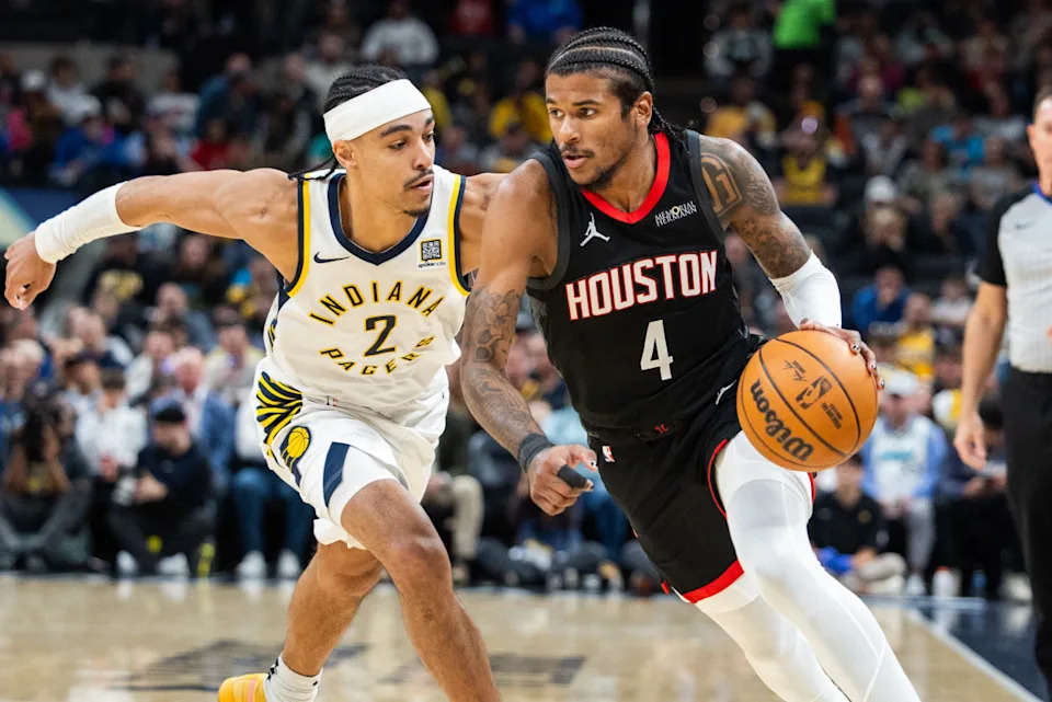 Mar 4, 2025; Indianapolis, Indiana, USA; Houston Rockets guard Jalen Green (4) dribbles the ball while Indiana Pacers guard Andrew Nembhard (2) defends in the first half at Gainbridge Fieldhouse.© Trevor Ruszkowski-Imagn Images