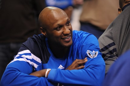 Ex-Mavericks power forward Lamar Odom (7) on the bench during a game against the Utah Jazz...