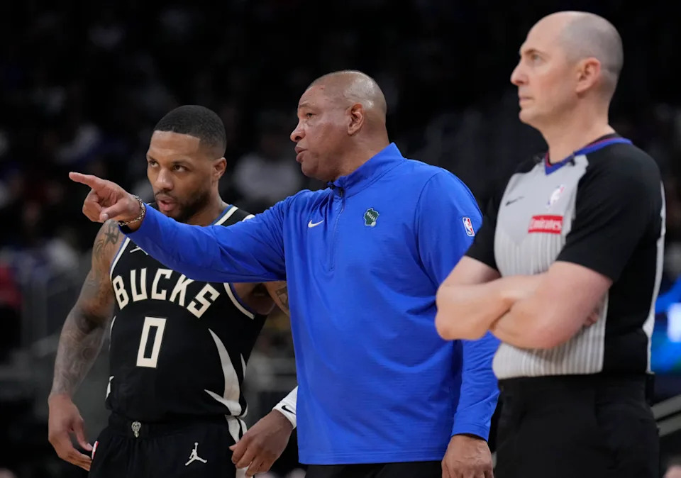 Milwaukee Bucks head coach Doc Rivers talks with Milwaukee Bucks guard Damian Lillard against the Cleveland Cavaliers in the second half at Fiserv Forum.Michael McLoone-Imagn Images