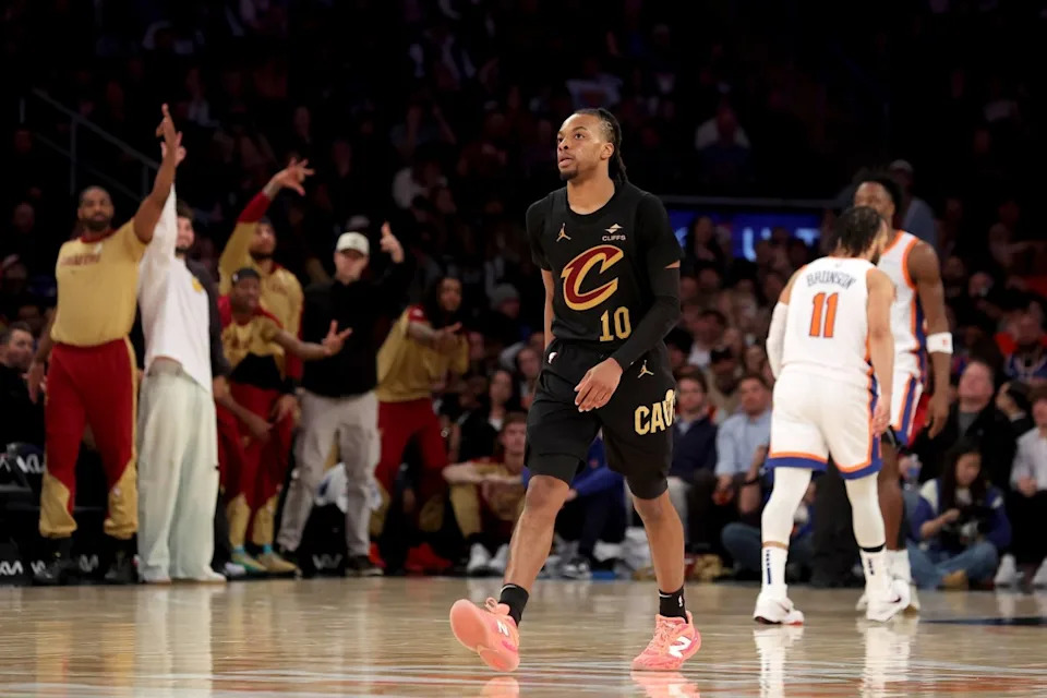 Cleveland Cavaliers guard Darius Garland (10) and the Cavaliers bench react after his three-point shot against the New York Knicks during the fourth quarter at Madison Square Garden. Mandatory Credit: Brad Penner-Imagn Images© Brad Penner-Imagn Images