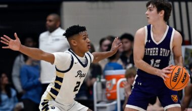 Kentucky Wildcats assistant Alvin Broooks checks out Trey Pearson